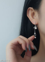 Long tassel pearl drop earrings