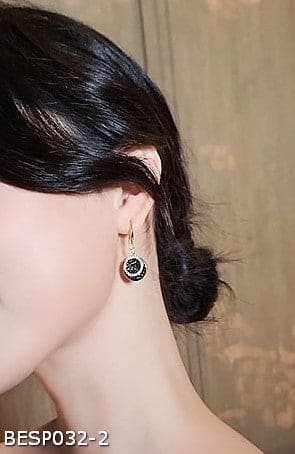 Black disc diamond earrings