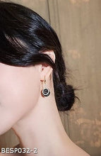 Black disc diamond earrings